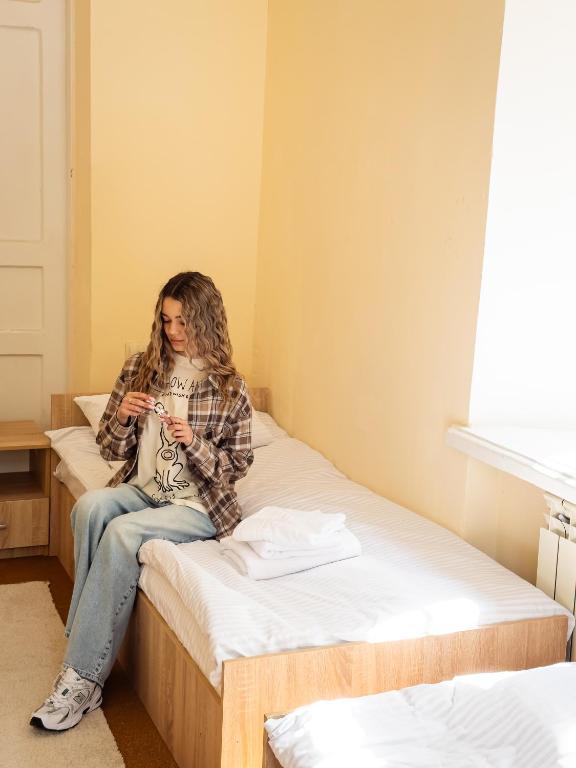 Postel nebo postele na pokoji v ubytování Green Palace