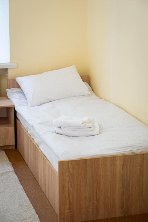 Postel nebo postele na pokoji v ubytování Green Palace