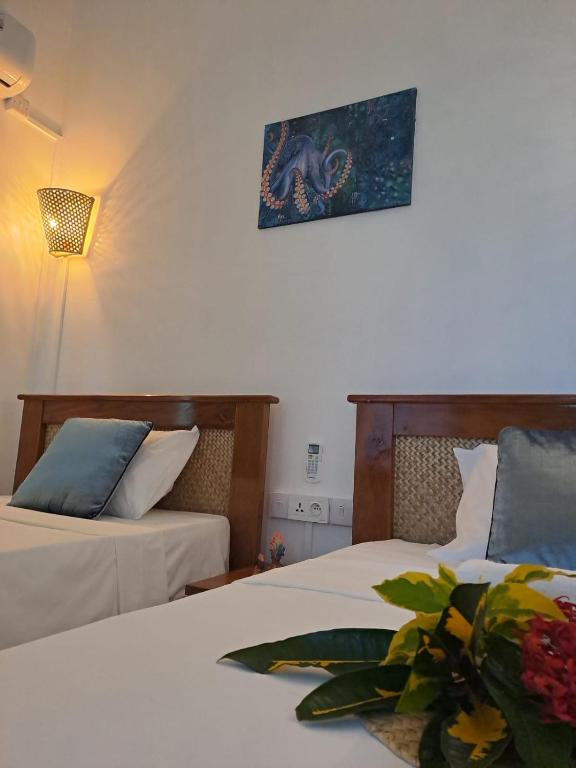 Postel nebo postele na pokoji v ubytování La Residence Emmaüs