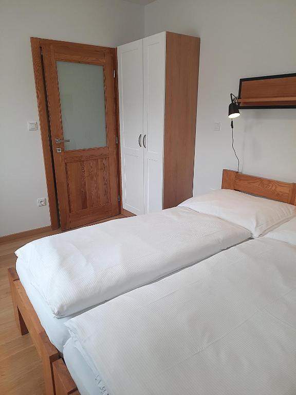 Postel nebo postele na pokoji v ubytování Penzion U Barana