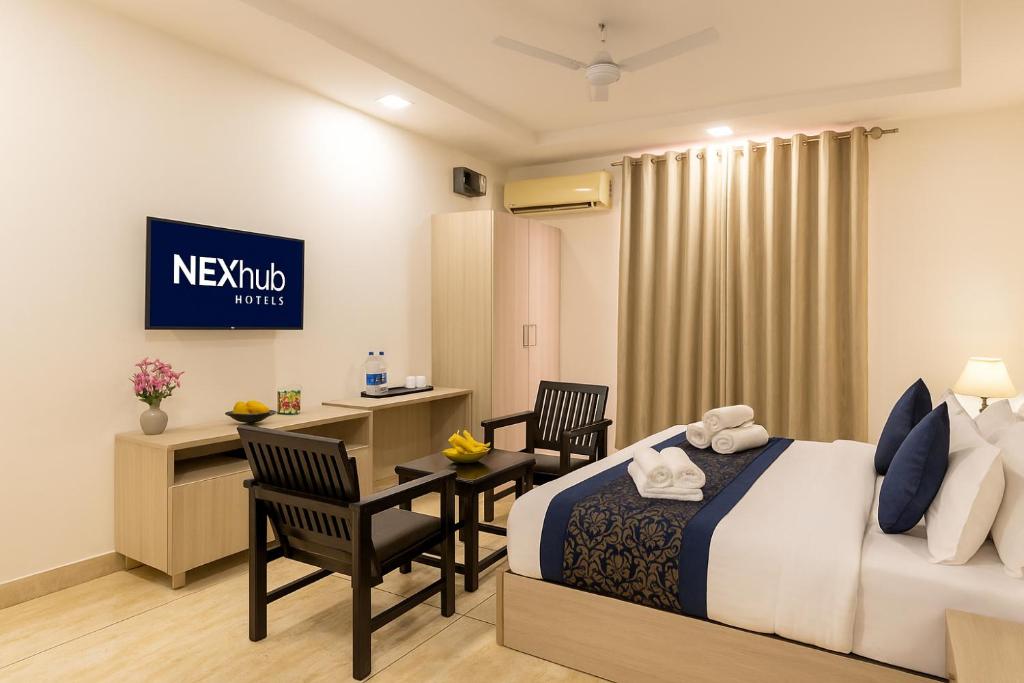 Postel nebo postele na pokoji v ubytování Nexhub Axis- Sector 39 Medanta