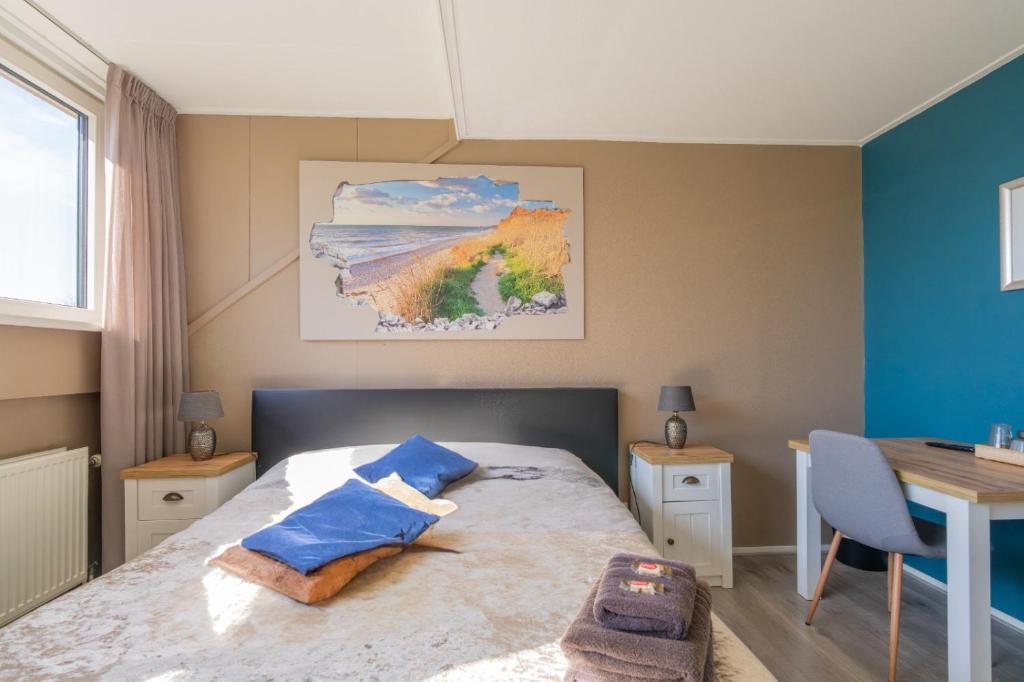 Postel nebo postele na pokoji v ubytování B&B Plompetorenzicht