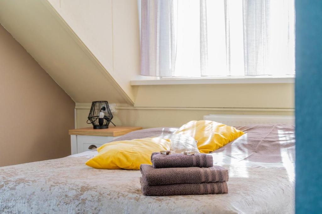 Postel nebo postele na pokoji v ubytování B&B Plompetorenzicht