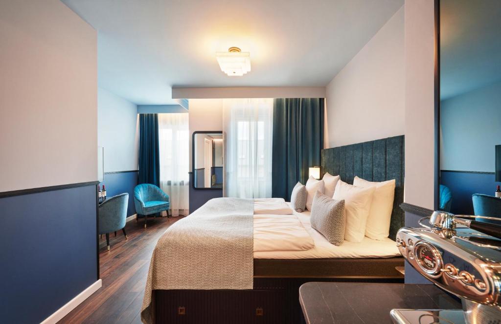 Postel nebo postele na pokoji v ubytování WIDE Hotel