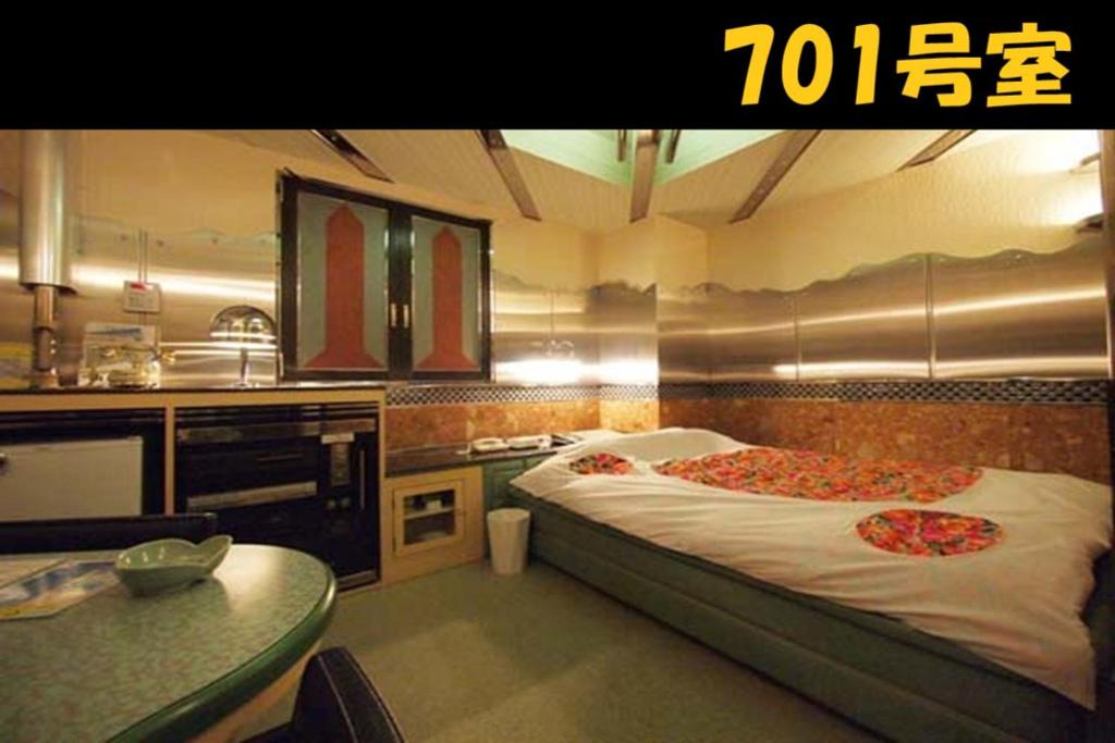 Postel nebo postele na pokoji v ubytování HOTEL Us Racecourse Adult only