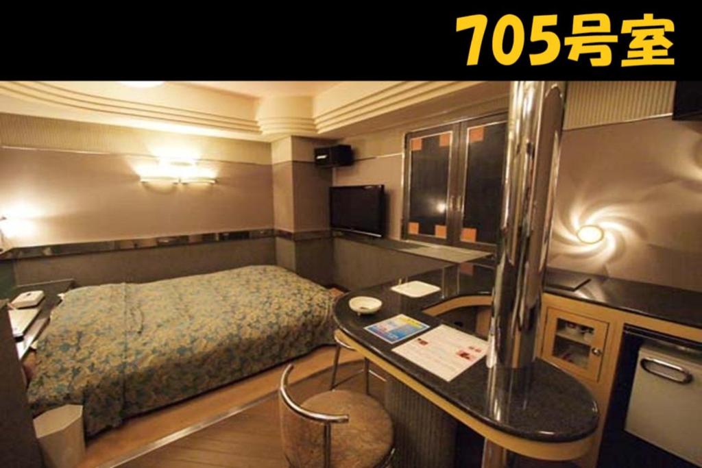Postel nebo postele na pokoji v ubytování HOTEL Us Racecourse Adult only