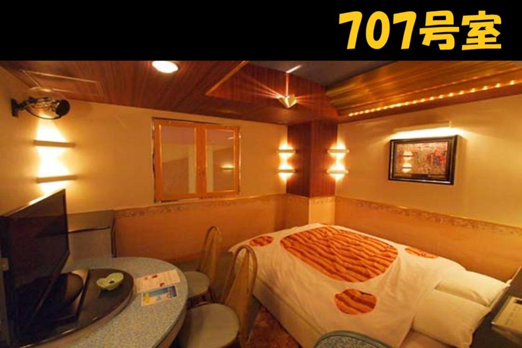 Postel nebo postele na pokoji v ubytování HOTEL Us Racecourse Adult only
