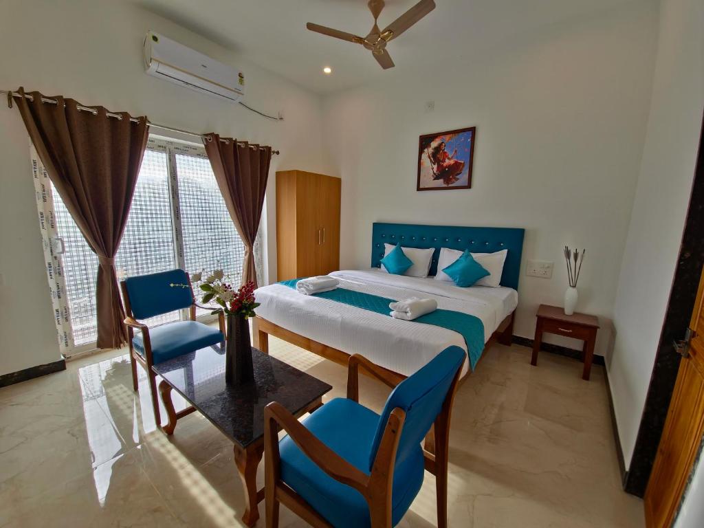 Postel nebo postele na pokoji v ubytování De Asian Resort Pondicherry