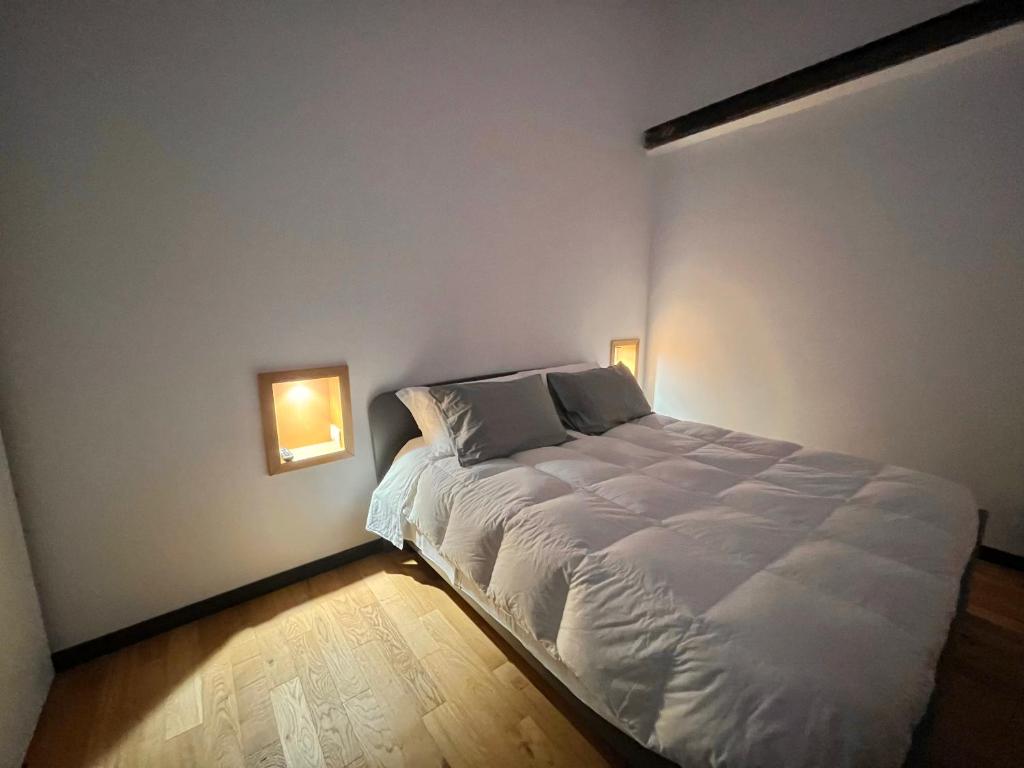 Postel nebo postele na pokoji v ubytování Dimore diffuse R H