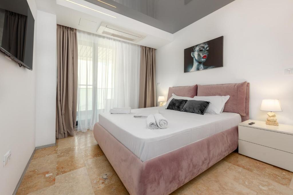 a bedroom with a large bed and a large window at Astria Palermo - Complex Novum in Olimp
