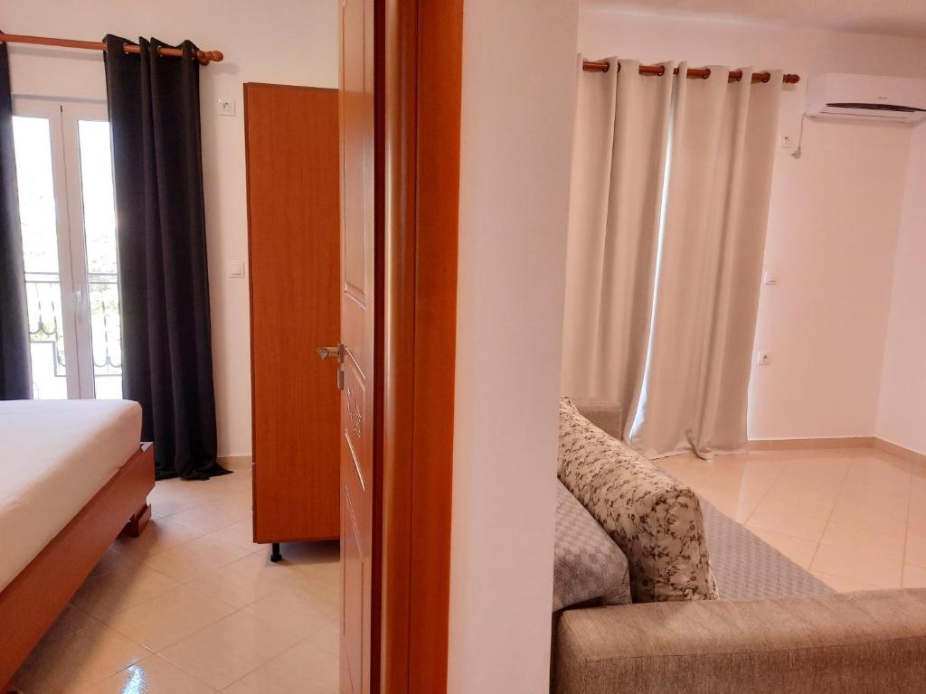 Кровать или кровати в номере Amarildo Hotel