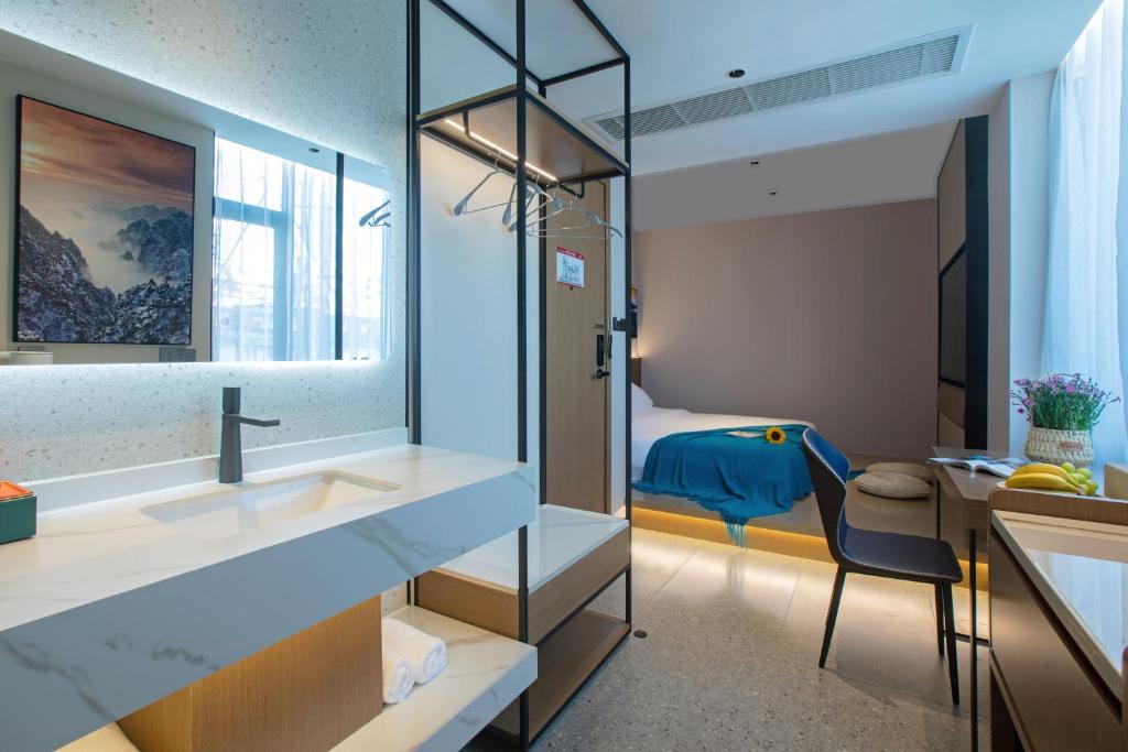Postel nebo postele na pokoji v ubytování ME Hotel
