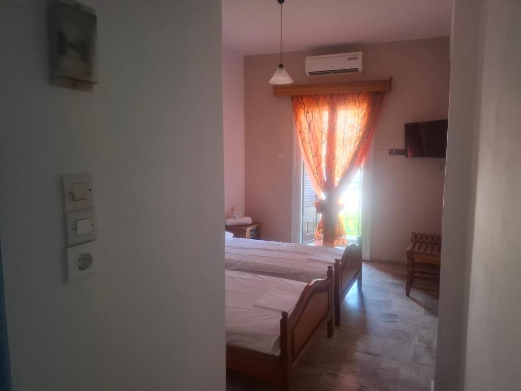 Postel nebo postele na pokoji v ubytování Hotel Galini