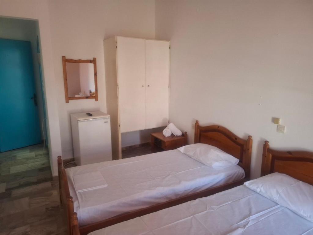 Postel nebo postele na pokoji v ubytování Hotel Galini