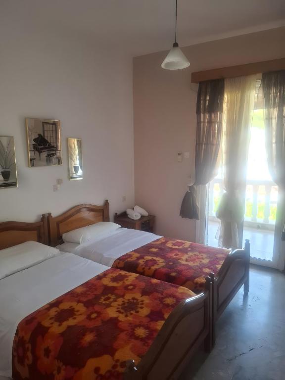 Postel nebo postele na pokoji v ubytování Hotel Galini