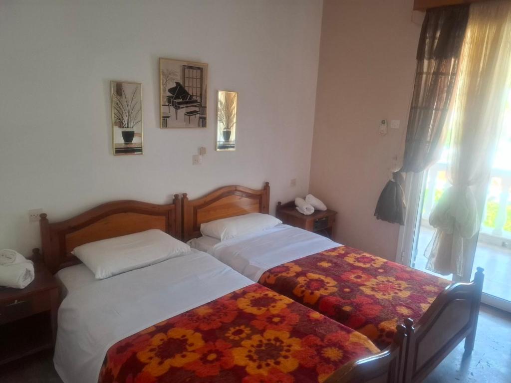 Postel nebo postele na pokoji v ubytování Hotel Galini