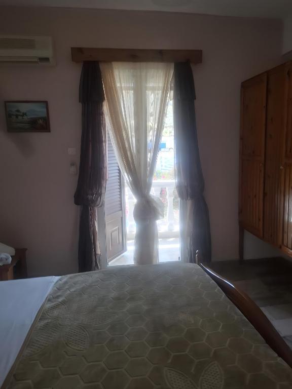 Postel nebo postele na pokoji v ubytování Hotel Galini