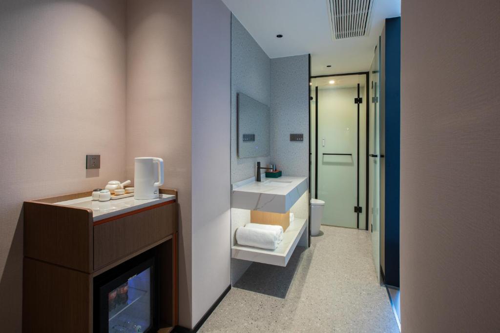 Postel nebo postele na pokoji v ubytování ME Hotel