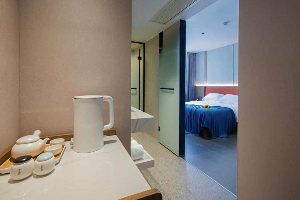 Postel nebo postele na pokoji v ubytování ME Hotel