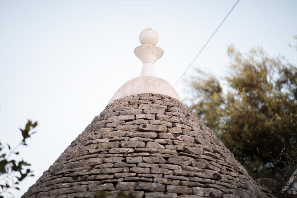 a view of the top of a brick building at Trullo La Dolce Kuki in La Correggia