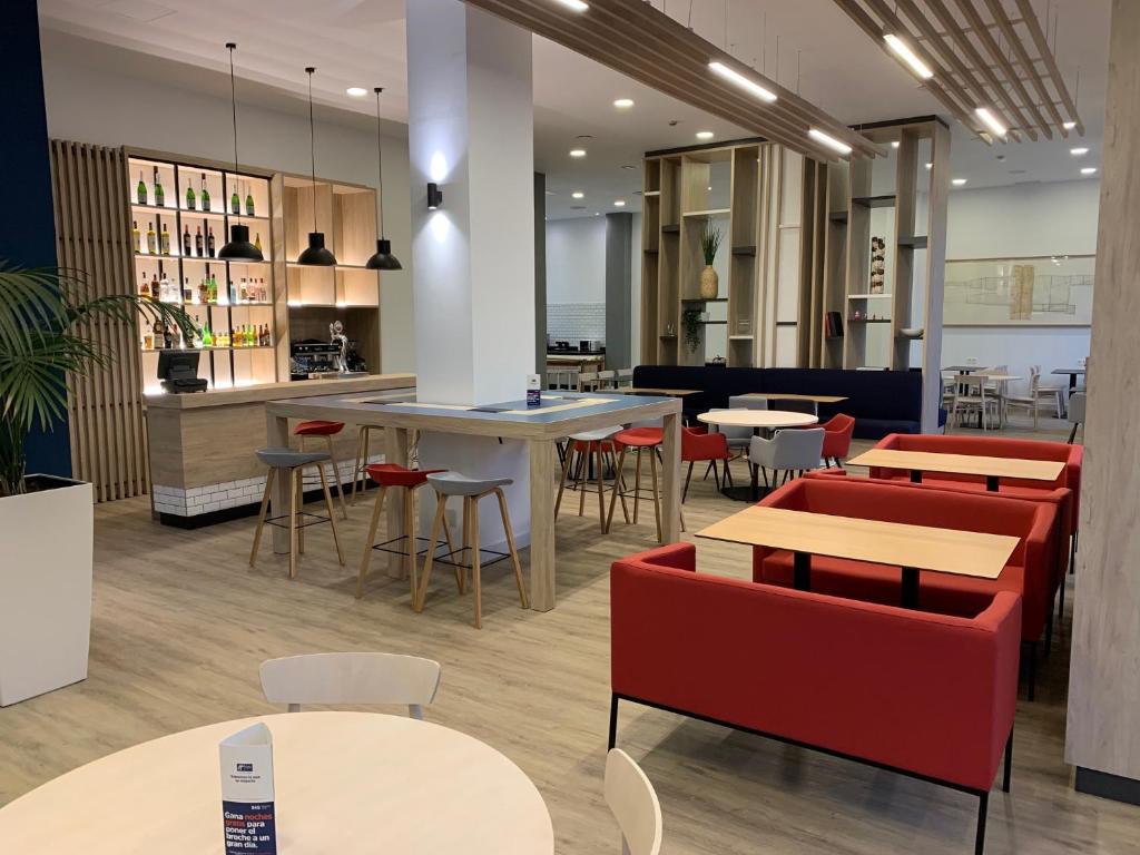 Posezení v ubytování Holiday Inn Express Ciudad de las Ciencias by IHG