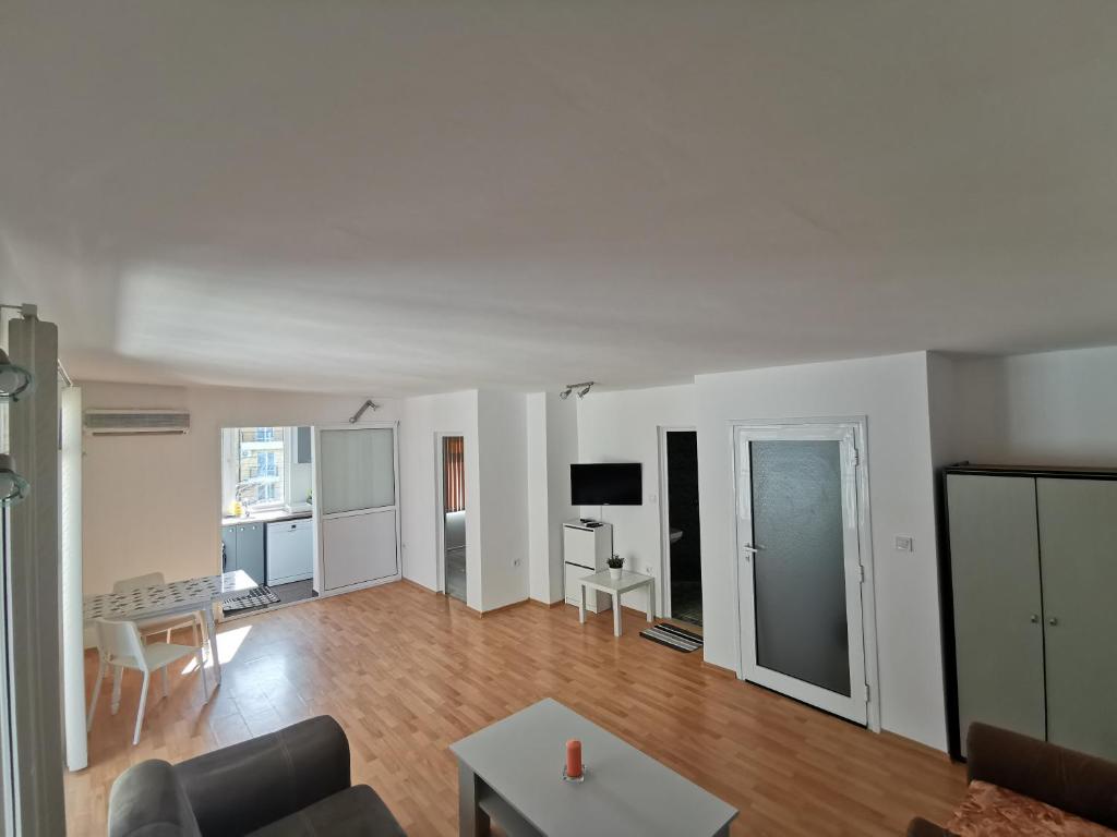 a living room with a couch and a table at Emona 5 floor 4 in Burgas City