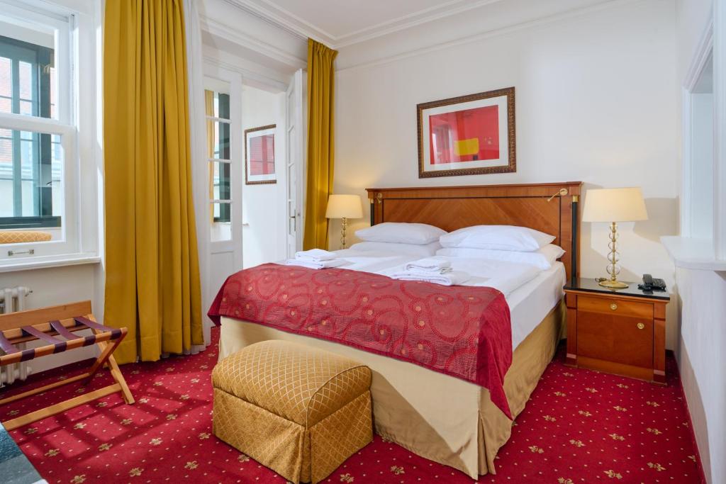 Postel nebo postele na pokoji v ubytování Hotel Bologna