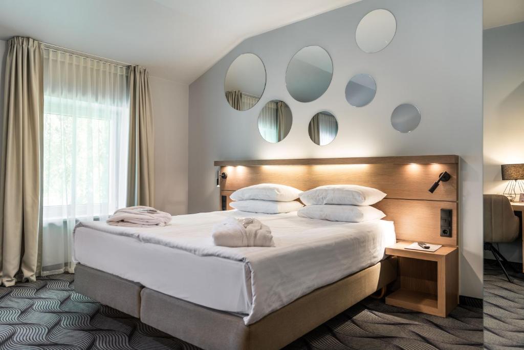 Postel nebo postele na pokoji v ubytování City Hotels Algirdas