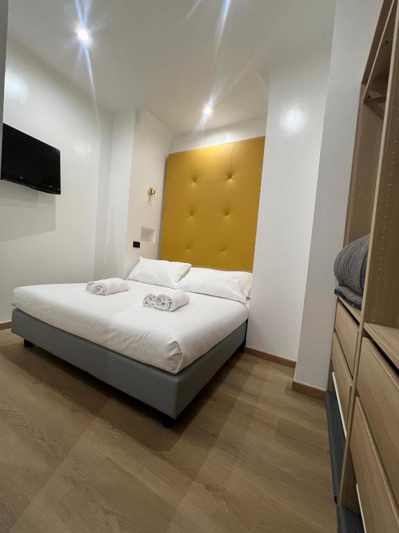 Postel nebo postele na pokoji v ubytování Hotel Ercoli House
