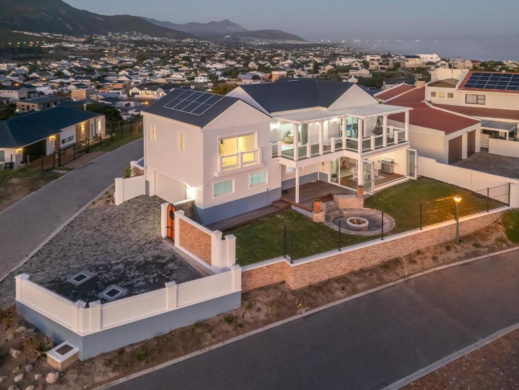 an overhead view of a house with solar panels on it at Vermont Vista - With Pool in Hermanus