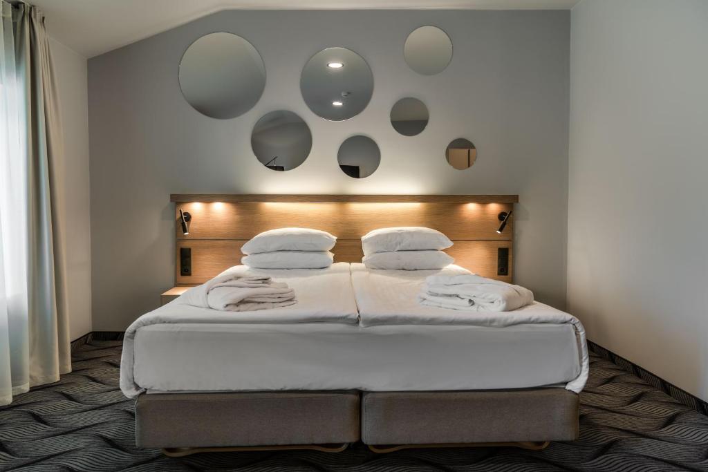 Postel nebo postele na pokoji v ubytování City Hotels Algirdas