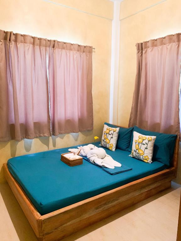 Postel nebo postele na pokoji v ubytování Kalija Homestay