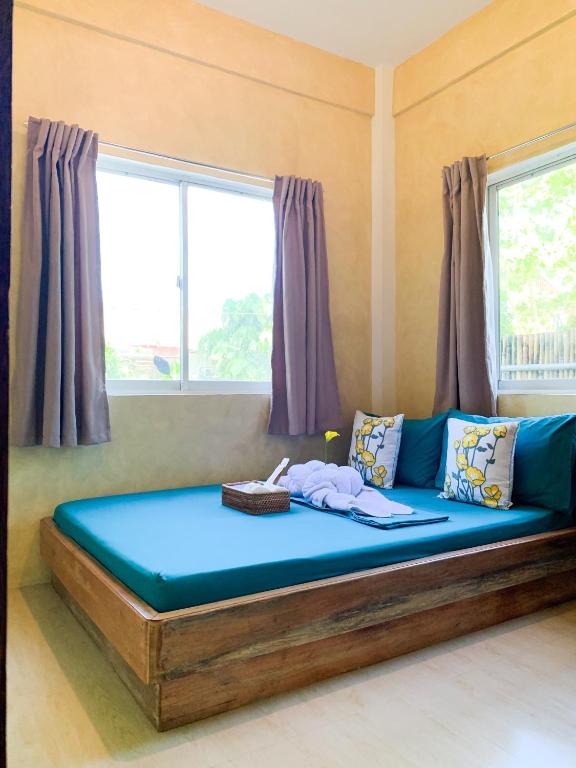 Postel nebo postele na pokoji v ubytování Kalija Homestay