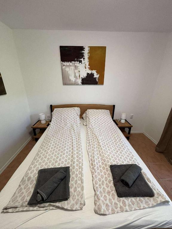 Postel nebo postele na pokoji v ubytování Soti Apartments