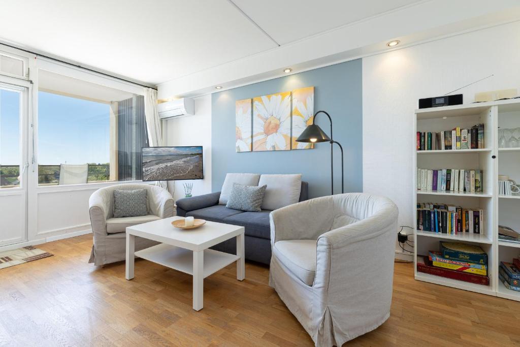 a living room with a couch and two chairs and a table at Marina Wendtorf Schwalbennest in Wendtorf