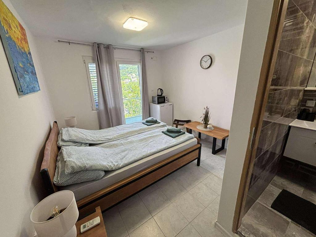 Postel nebo postele na pokoji v ubytování Soti Apartments