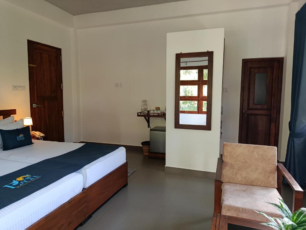 Postel nebo postele na pokoji v ubytování Eagle Wilpattu Resort