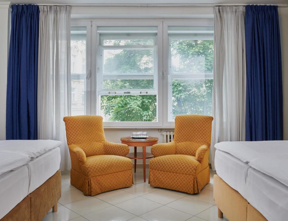 Postel nebo postele na pokoji v ubytování Hotel Bologna