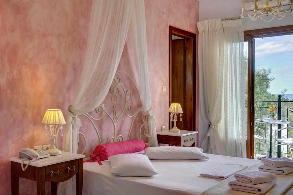 Postel nebo postele na pokoji v ubytování Hotel Agnadi - Horefto