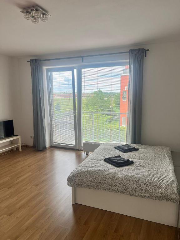 Postel nebo postele na pokoji v ubytování Airport Apartman Víšek