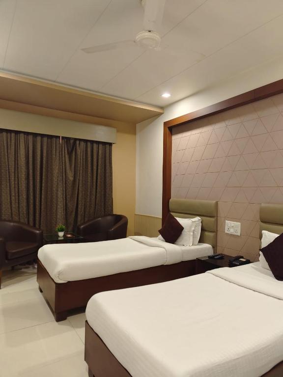 Postel nebo postele na pokoji v ubytování TGV Hotel