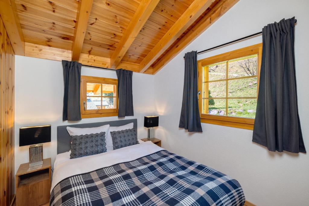 Chalet Belle Vue – Alpine Charm with a View to Remember客房内的一张或多张床位