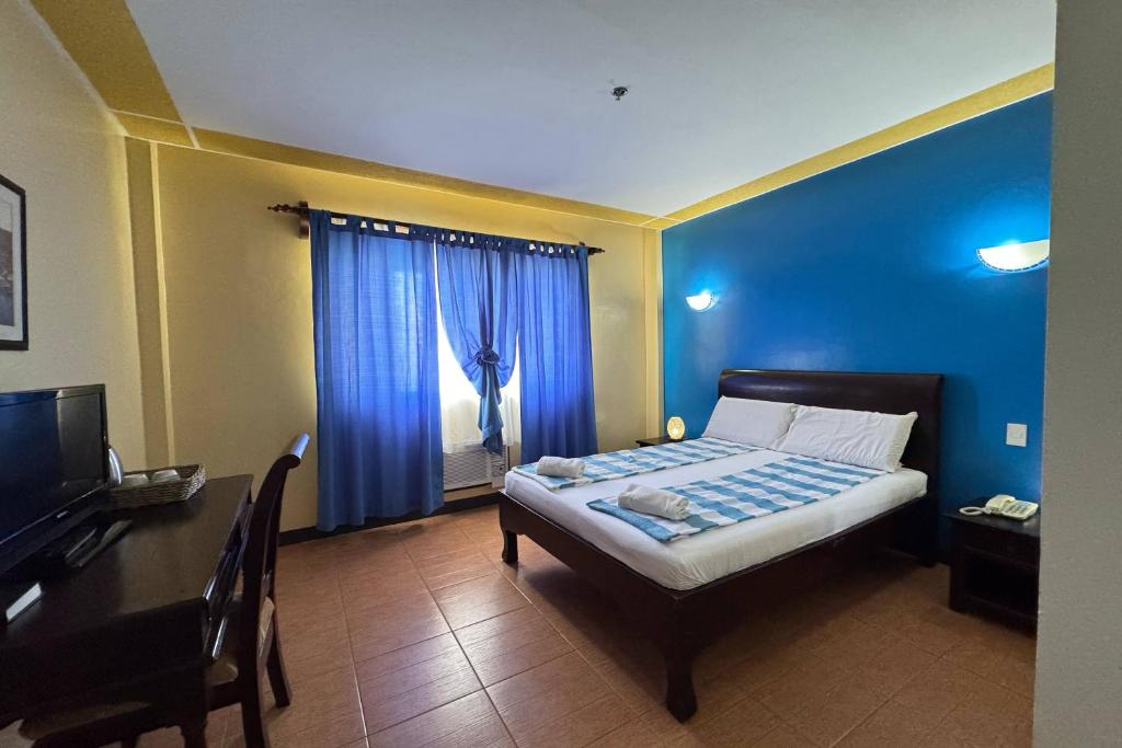 Postel nebo postele na pokoji v ubytování OveMar Resort Hotel near Vigan
