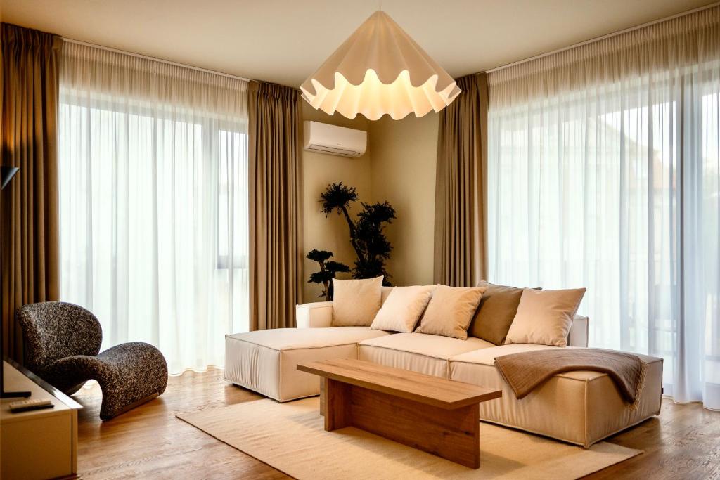 a living room with a couch and a table at Nook in Timişoara