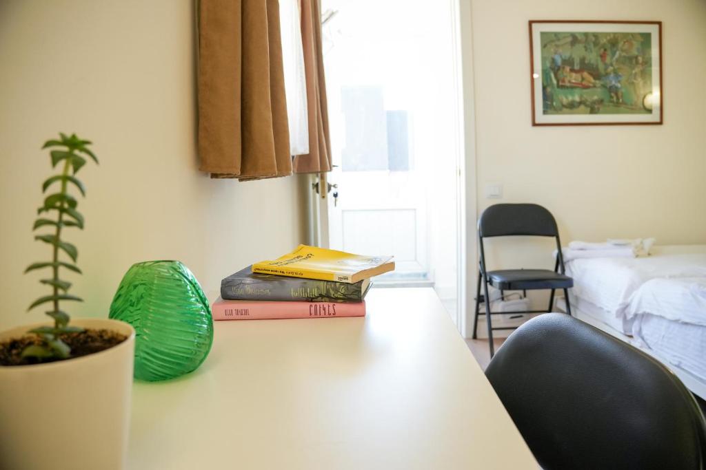 Postel nebo postele na pokoji v ubytování Communa Guesthouse