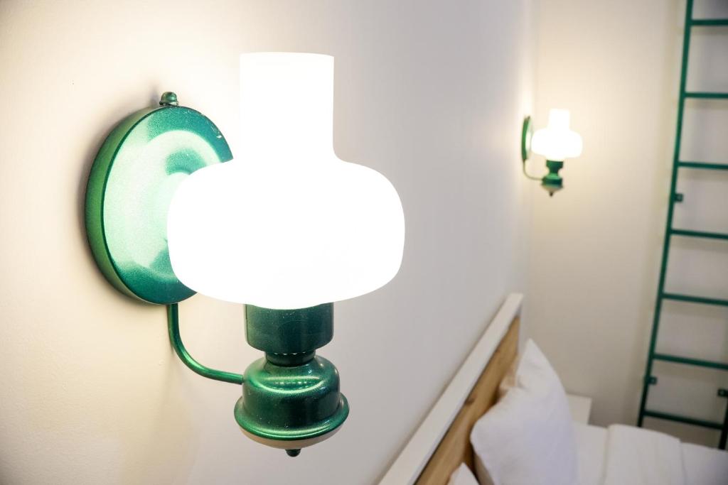 Postel nebo postele na pokoji v ubytování Communa Guesthouse