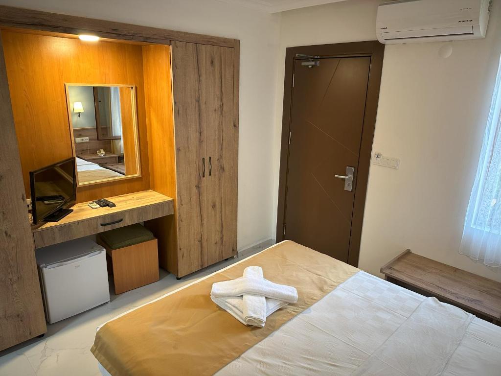 Postel nebo postele na pokoji v ubytování Katre Hotel Oludeniz