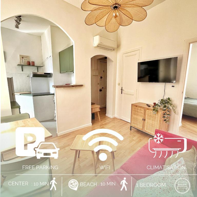 Il comprend une cuisine et un salon avec une table. dans l'établissement Lumineux et charmant deux pièce - Menton, à Menton