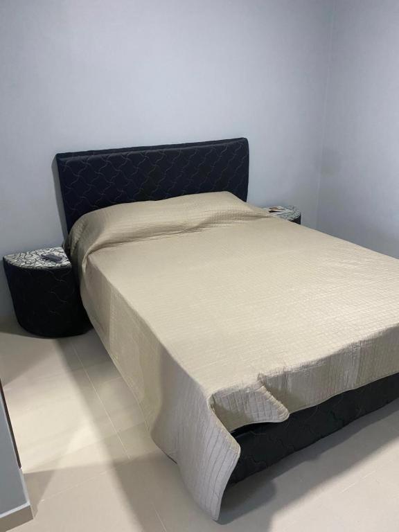 Postel nebo postele na pokoji v ubytování España Suites Hotel