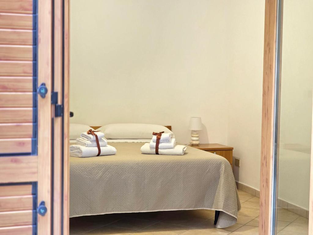 Postel nebo postele na pokoji v ubytování Oasi Relais